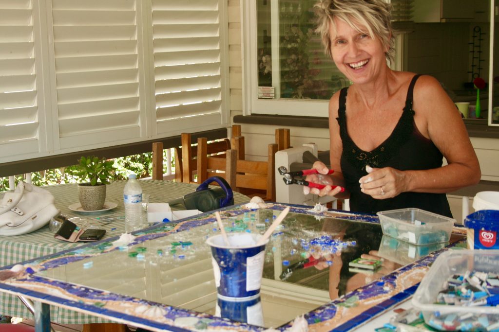 lady creating mosaic art work